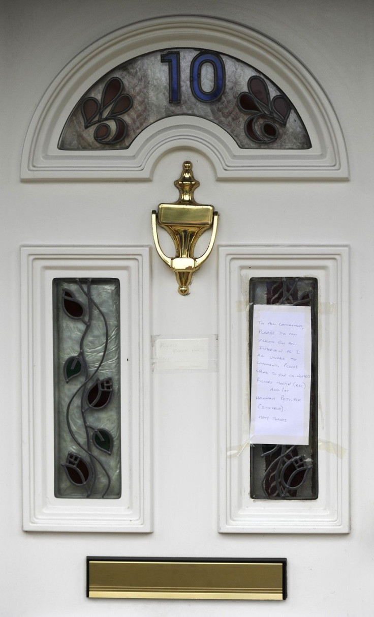 A note addressed to the news media is seen on the door of the home of Ryan Cleary, a British teenager arrested in Wickford, eastern England