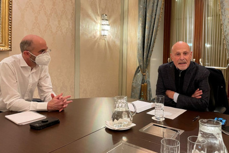 U.S. Special Envoy for Iran Robert Malley and Barry Rosen, campaigning for the release of hostages imprisoned by Iran, sit at a table during an interview with Reuters in Vienna, Austria, January 23, 2022.  
