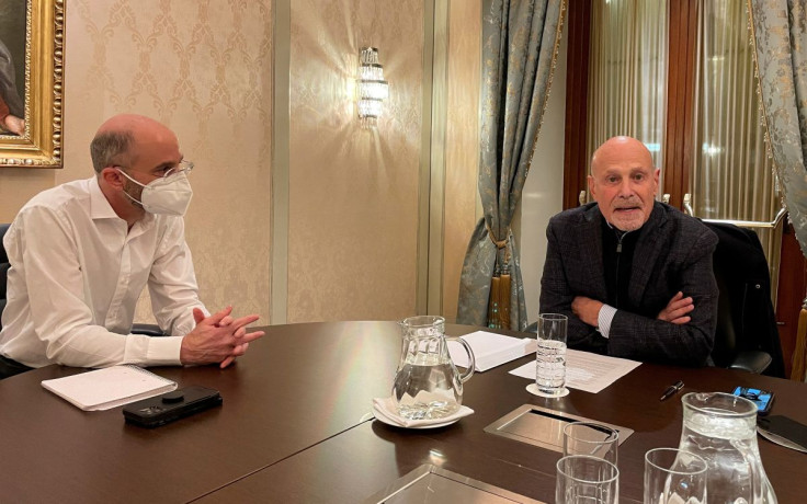 U.S. Special Envoy for Iran Robert Malley and Barry Rosen, campaigning for the release of hostages imprisoned by Iran, sit at a table during an interview with Reuters in Vienna, Austria, January 23, 2022.
