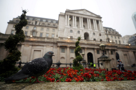 A pigeon stands in front of the Bank of England in London, Britain, April 9, 2018. 