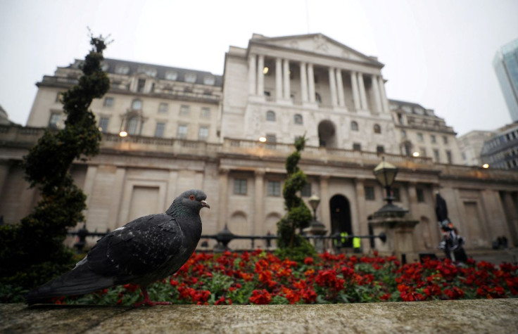 A pigeon stands in front of the Bank of England in London, Britain, April 9, 2018. 