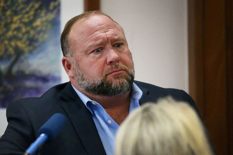 Alex Jones attempts to answer questions about his emails asked by Mark Bankston, lawyer for Neil Heslin and Scarlett Lewis, during trial at the Travis County Courthouse, Austin, Texas, US, August 3, 2022. Briana Sanchez/Pool via 
