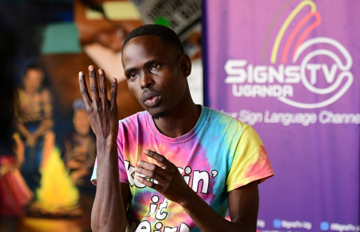 Signs TV Uganda Team Leader Simon Eropu gestures during an interview with Reuters inside their studio in Kabalagala suburb of Kampala, Uganda July 18, 2022. 