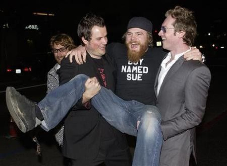 Steven Green (L), the director of &#039;&#039;Gumball 3000 - The Movie,&#039;&#039; cast member Ryan Dunn (C) and Maximillion Cooper, who launched &#039;&#039;Gumball 3000&#039;&#039; in 1999, ham it up for photographers during the premiere of the film at