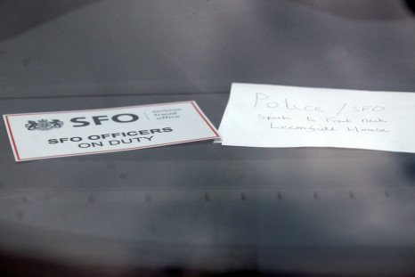 A sign is displayed in an unmarked Serious Fraud Office vehicle parked outside a building, in Mayfair, central London March 9, 2011.  