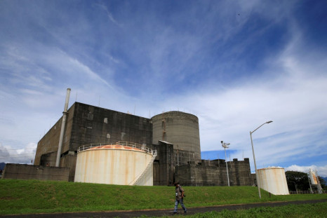 FILE PHOTO - A local photographer walks past the Bataan Nuclear Power Plant (BNPP) during a media tour around the BNPP compound in Morong town, Bataan province, Philippines September 16, 2016. 