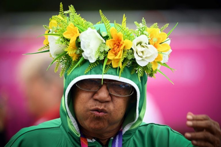 A Cook Islands coach watches lawn bowls at the 2022 Commonwealth Games