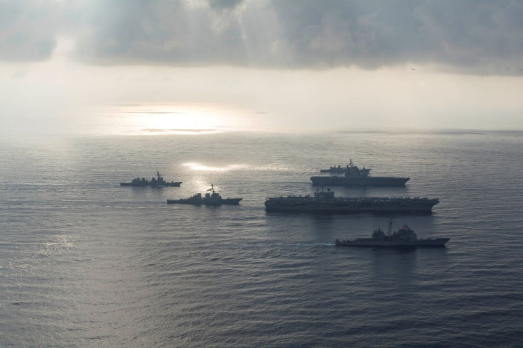 The Ronald Reagan Strike Group ship's the aircraft carrier USS Ronald Reagan (CVN 76), the guided-missile cruiser USS Antietam (CG 54) and the guided-missile destroyer USS Milius (DDG 69) conduct a photo exercise with the Japan Maritime Self-Defense Force