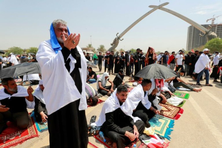Supporters of Iraqi cleric Moqtada Sadr gather for prayers at the Green Zone in Baghdad, where they occupy the parliament