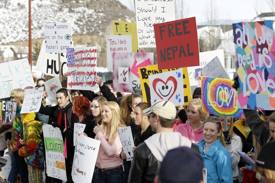 Students hold signs across from members of the Westboro Baptist Church protesting the upcoming premiere of quotRed Statequot during the Sundance Film Festival in Park City