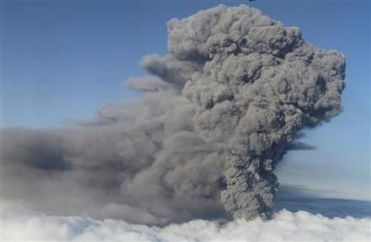 An ash plume rises from a volcano 