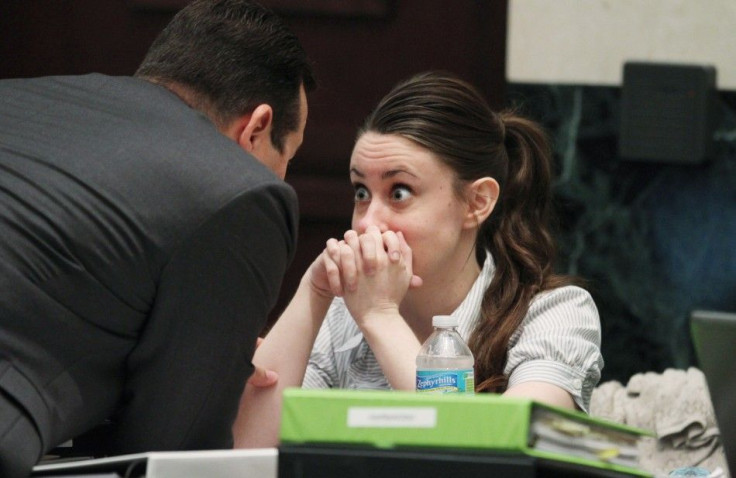 Casey Anthony talks with her attorney Jose Baez