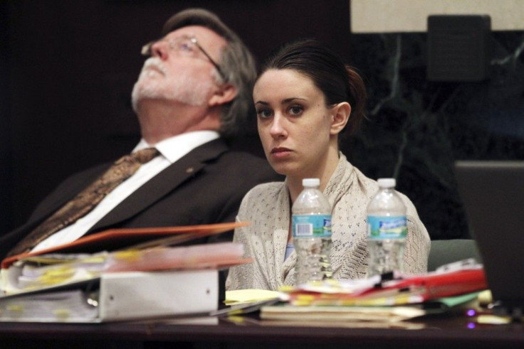 Casey Anthony looks on beside her attorney Cheney Mason