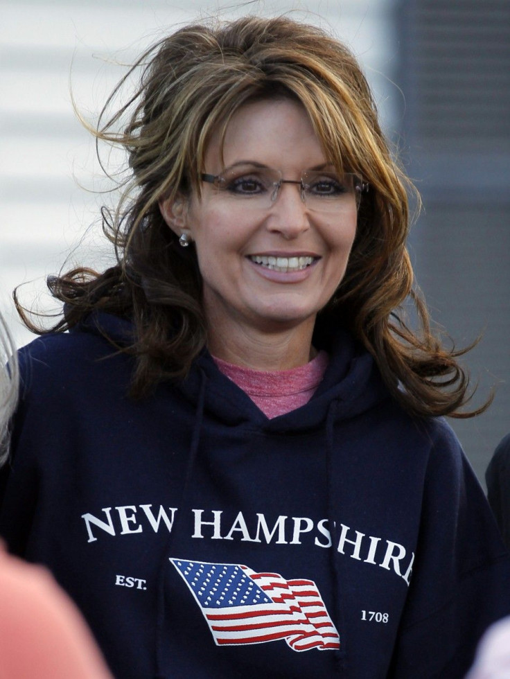Former Alaska Governor Sarah Palin wears a New Hampshire sweatshirt during a stop at a clam bake at a private residence in Seabrook