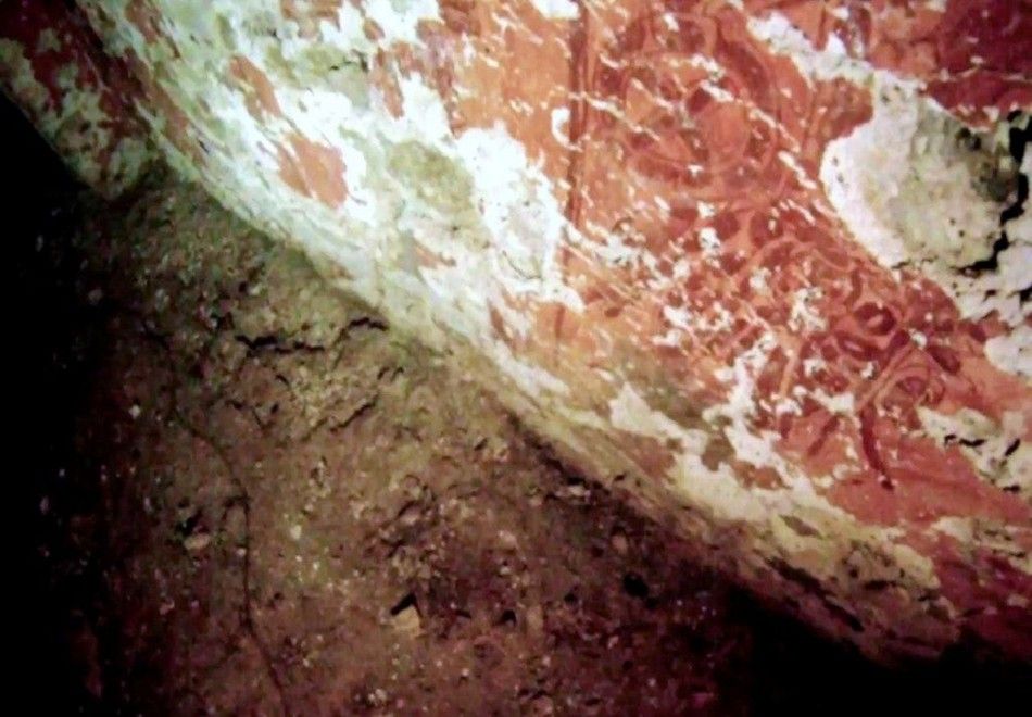 Undated handout photo by the INAH shows red frescoes inside the tomb of a Mayan ruler at the ruins of the Mayan city of Palenque in the Mexican state of Chiapas