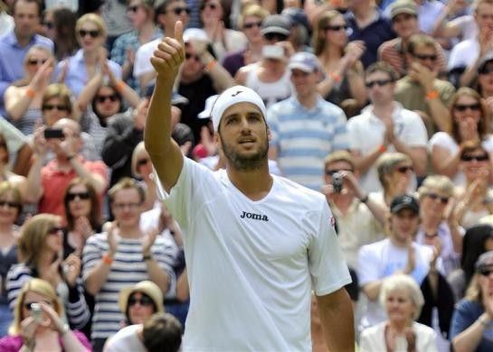 Feliciano Lopez of Spain reacts after defeating Andy Roddick