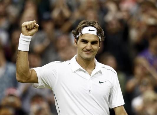 Roger Federer of Switzerland celebrates after defeating Adrian Mannarino