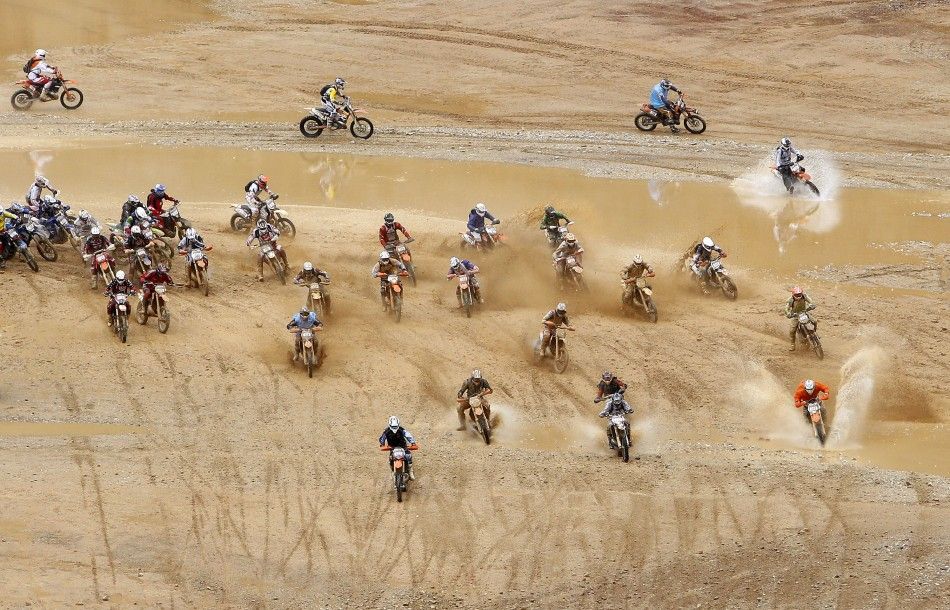 Motocross riders participate in the 039Red Bull Hare Scramble039 race during Erzberg Rodeo near the village of Eisenerz