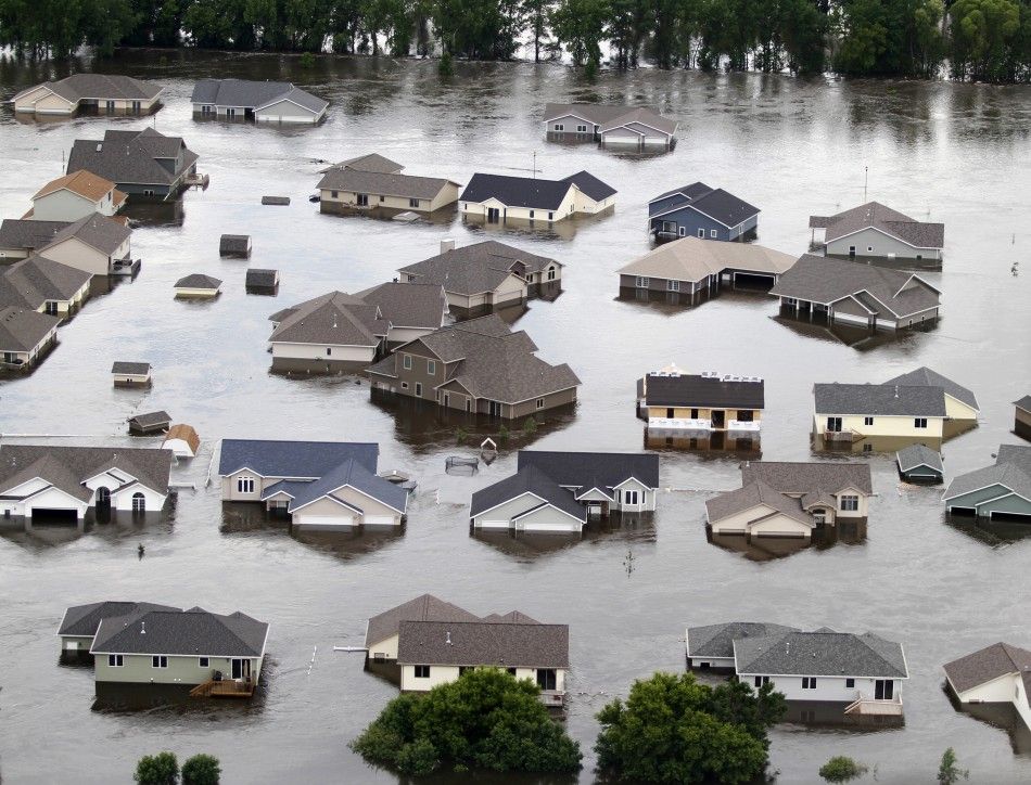 Newer houses on the southwest side of Minot, North Dakota, are seen submerged in flood waters