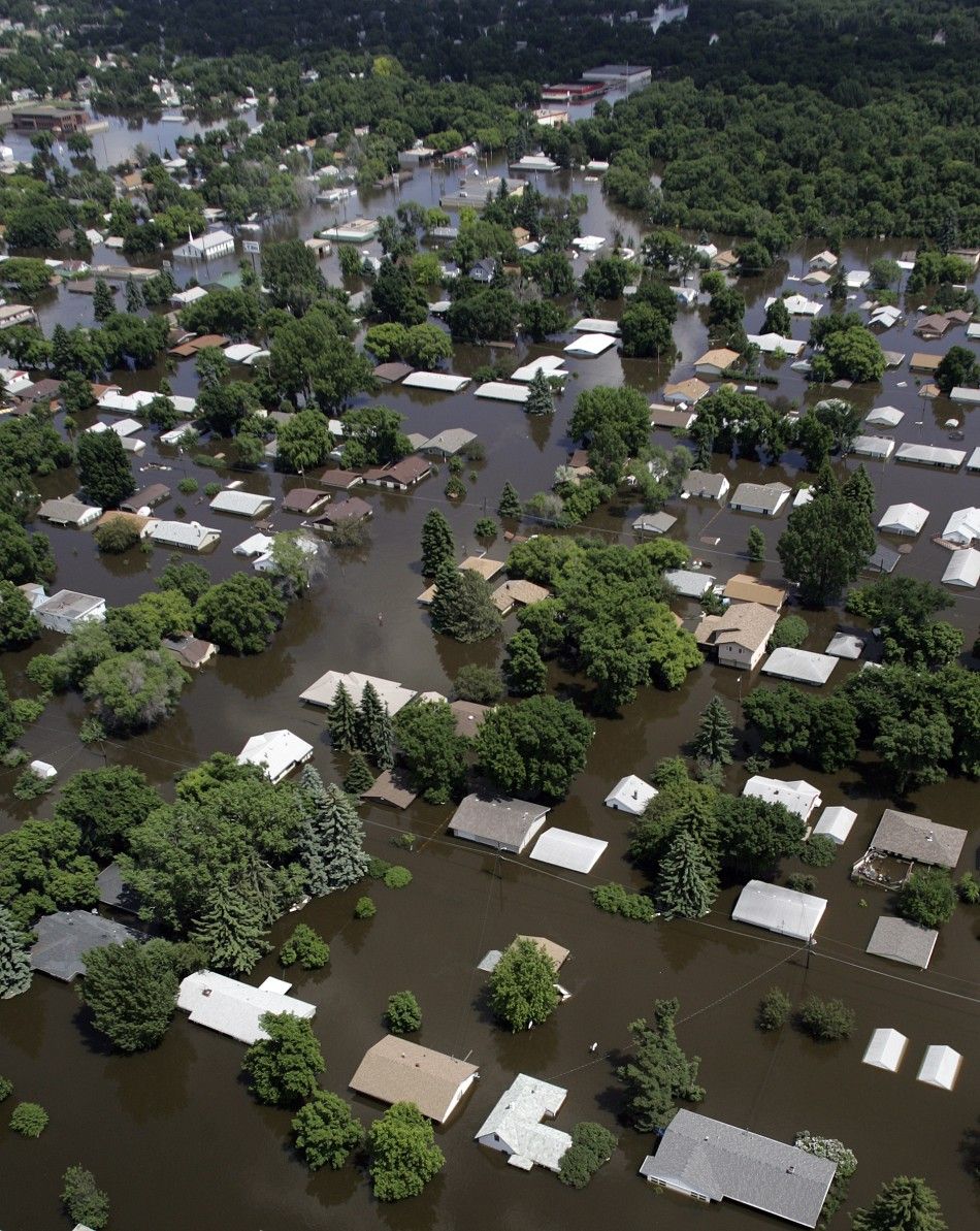 Rapidly rising Souris River engulfs Minot