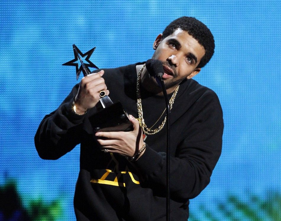 Drake accepts the viewers choice award for Rihanna, that was awarded to her by mistake, at the 2011 BET Awards in Los Angeles June 26, 2011. Chris Brown was the actual winner of the award.