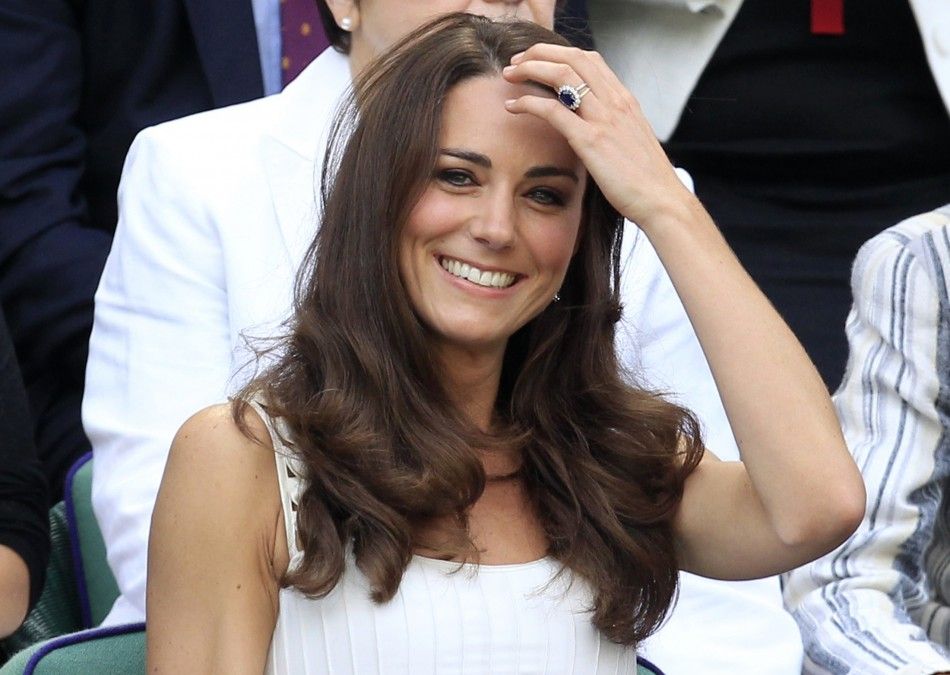 Britain039s Catherine, Duchess of Cambridge sits in the Royal Box on Centre Court for the match between Andy Murray of Britain and Richard Gasquet of France at the Wimbledon tennis championships in London June 27, 2011.