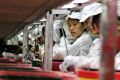 Workers are seen inside a Foxconn factory in the township of Longhua in the southern Guangdong province May 26, 2010