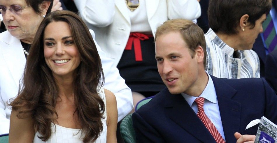 Britains Catherine, Duchess of Cambridge sits with Her Husband Prince William