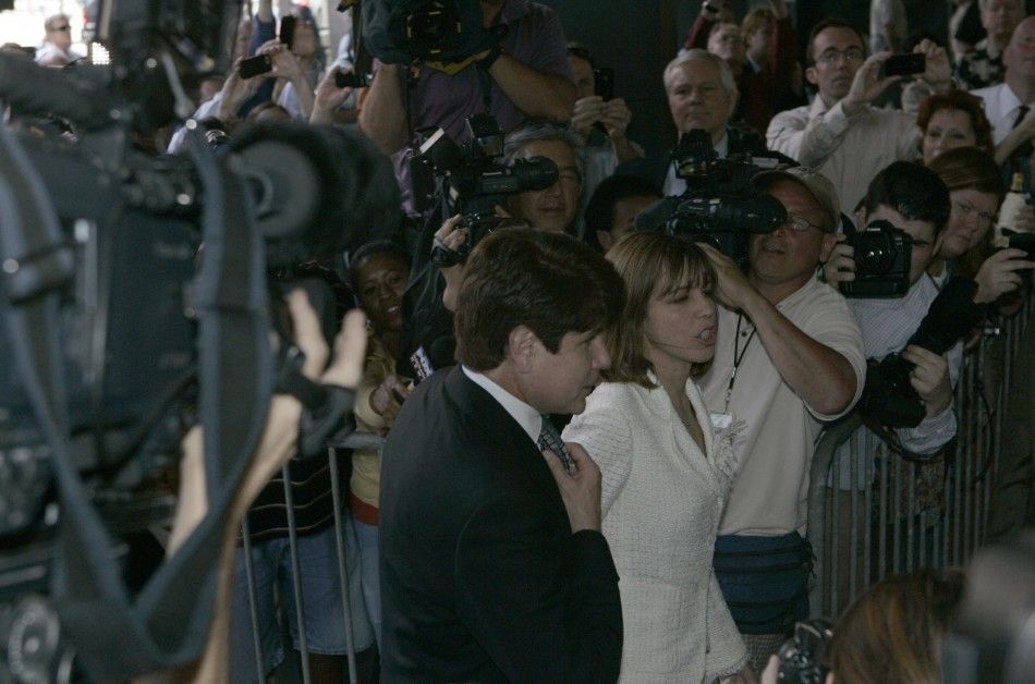 ormer Illinois Governor Rod Blagojevich and his wife Patti make their way past a hoard of media and onlookers as they enter the Dirksen Federal building to hear the verdict on his second corruption trial in Chicago