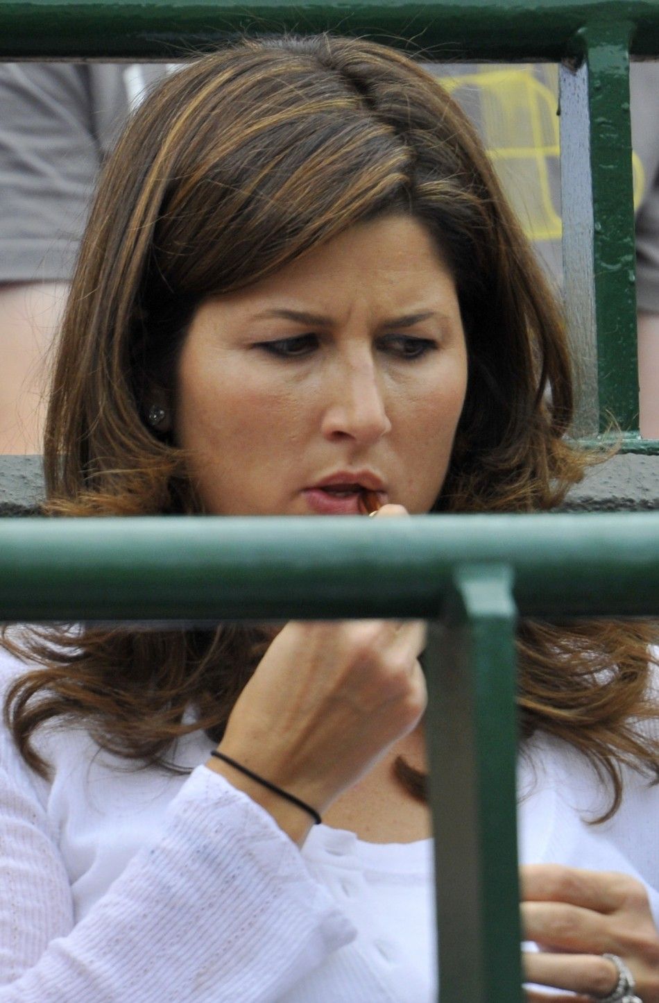 The wife of Roger Federer of Switzerland, Mirka Federer, sits on Court 1 for Federer039s match against Mikhail Youzhny of Russia at the Wimbledon tennis championships in London