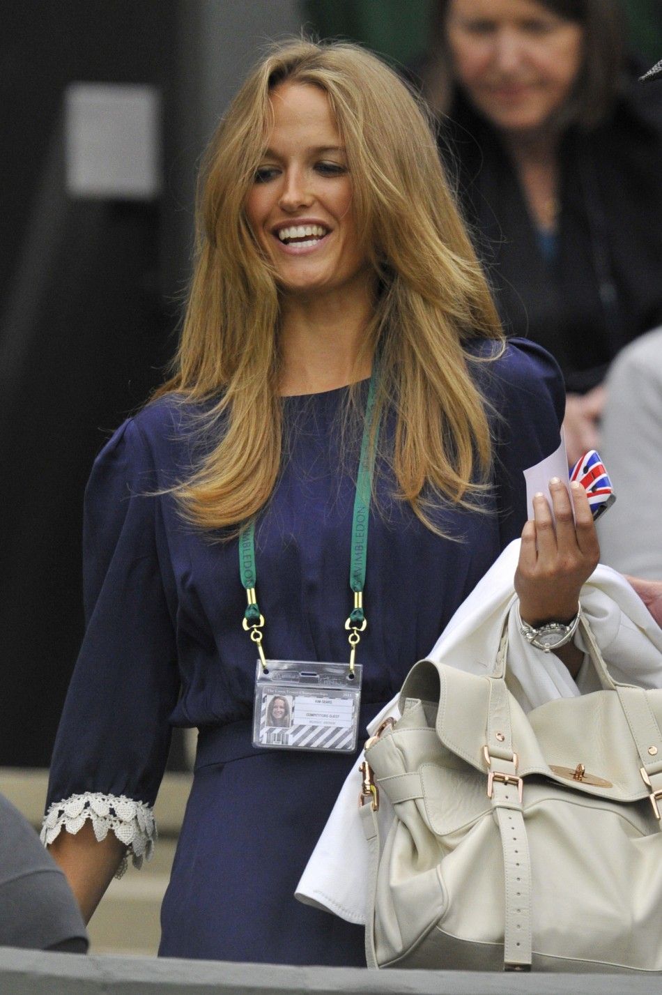 Kim Sears, the girlfriend of Andy Murray of Britain, arrives on Centre Court for the match between Murray and Ivan Ljubicic of Croatia at the Wimbledon tennis championships in London