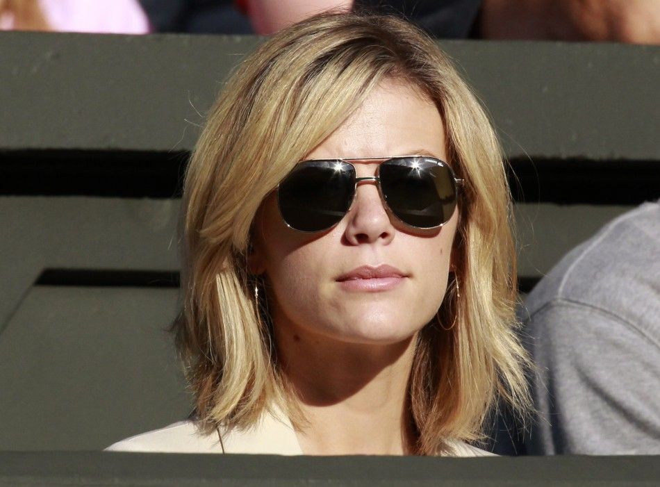 Brooklyn Decker, the wife of Andy Roddick of the U.S., sits on Centre Court for Roddick039s match against Victor Hanescu of Romania at the Wimbledon tennis championships in London