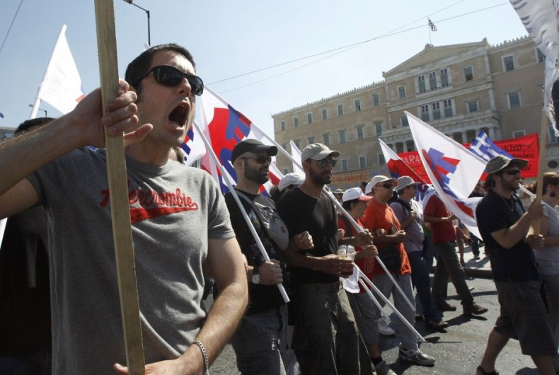 Demonstrators march in protest against austerity measures in front of the Greek parliament in Athens