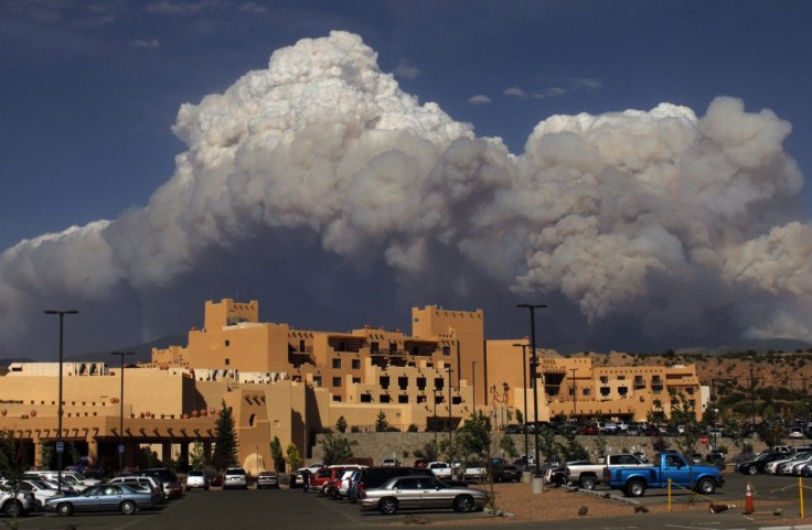 Smoke from the Pacheco Canyon Wildfire rises behind the Buffalo Thunder Casino in Pojoaque, New Mexico