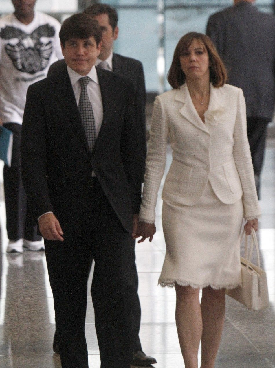 Former Illinois Governor Rod Blagojevich and his wife Patti hold hands as they leave the Dirksen Federal building after he was convicted on 17 of 20 counts in his second corruption in Chicago
