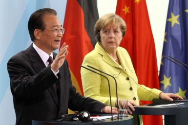 China&#039;s Premier Wen gestures as he addresses a news conference with German Chancellor Merkel at the Chancellery in Berlin