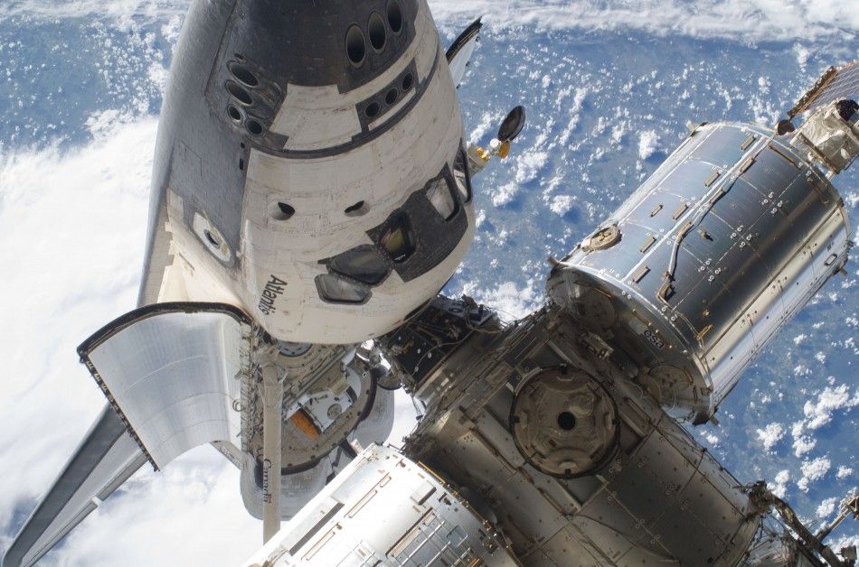 The Space Shuttle Atlantis STS-132 and part of the International Space Station are seen while the two spacecraft remain docked in this NASA handout photo dated May 17, 2010.