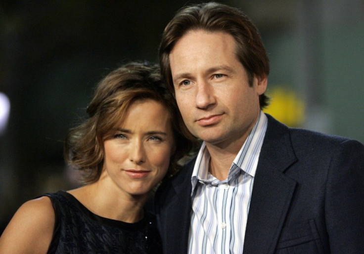 Cast member Tea Leoni and her husband David Duchovny attend the Los Angeles premiere of Columbia pictures&#039; &quot;Fun with Dick and Jane&quot; at the Mann Village theatre in Los Angeles December 14, 2005.