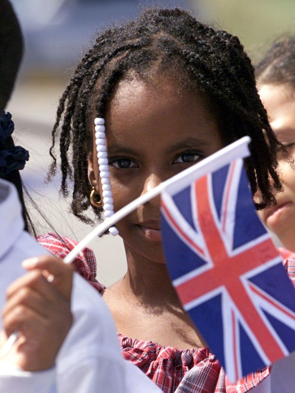 Most Jamaicans Would Prefer To Remain British IBTimes   Jamaican Children Wave Flags They Await Britain039s Queen Elizabeth Montego Bay039s 