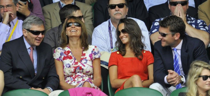 The parents of Catherine, Duchess of Cambridge, Michael (L) and Carole Middleton (2nd L), and her sister Pippa (3rd L), sit on Centre Court for the quarter-final match between Jo-Wilfried Tsonga of France and Roger Federer of Switzerland at the Wimbledon 