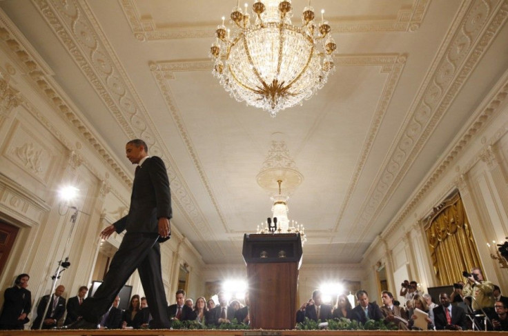 U.S. President Obama walks off stage following a news conference in Washington