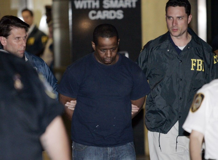 James Cromitie, center, is led by police officers from a federal building in Manhattan after being arrested in connection with a plot to bomb New York synagogues and shoot down military aircraft, officials said.