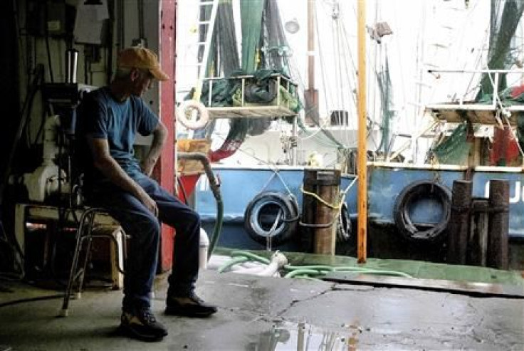 Twenty-Seven year shrimp farmer Robert Armand sits idle at Dean Blanchard Seafood in Grand Isle
