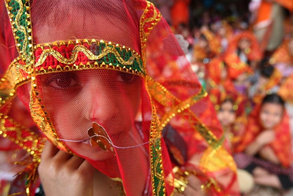 A girl attends a prayer ceremony inside a temple during celebrations to mark the quotNavratriquot festival in Chandigarh