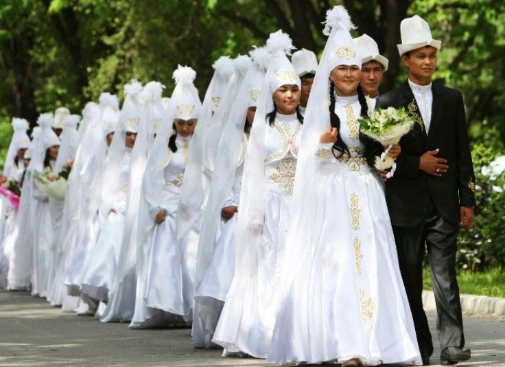 Brides and grooms leave after a mass wedding ceremony in the Kyrgyz capital of Bishkek May 7, 2011