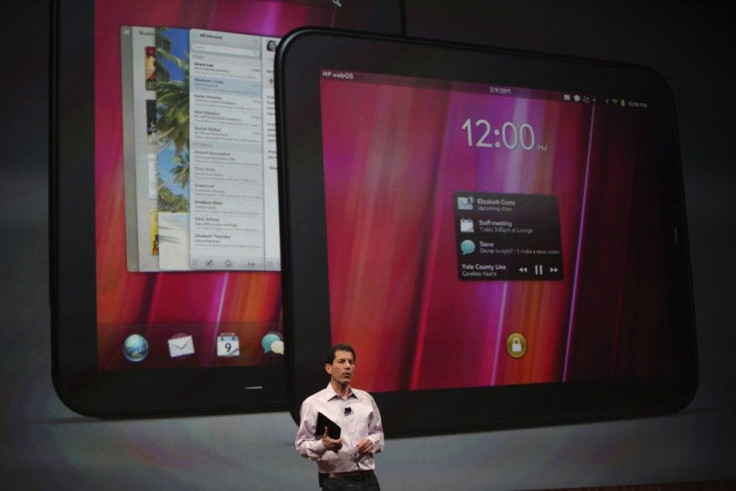 Jon Rubinstein, senior vice president and general manager for Palm, holds the Palm TouchPad during a media presentation