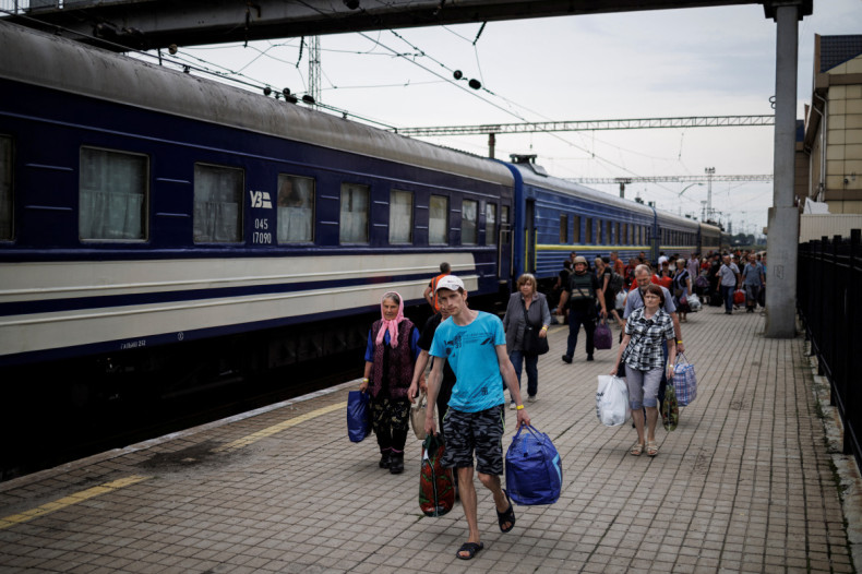 People arrive to board a train during an evacuation effort from war-affected areas of eastern Ukraine, in Pokrovsk