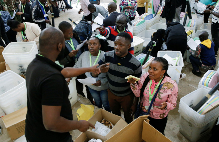 Electoral officials prepare voting materials ahead of the general elections in Nairobi