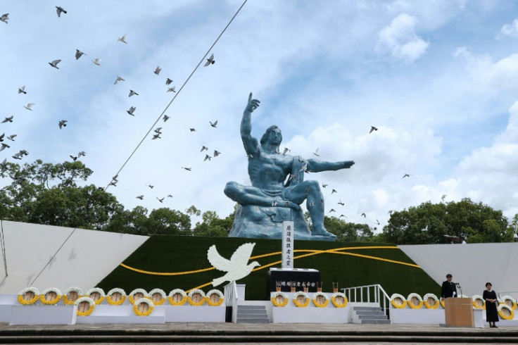 Bells rang out and doves were released during the sombre memorial at Nagasaki's Peace Park