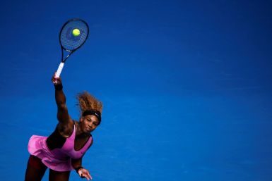 Serena Williams of the U.S. serves to Ana Ivanovic of Serbia during their women's singles match at the Australian Open 2014 tennis tournament in Melbourne